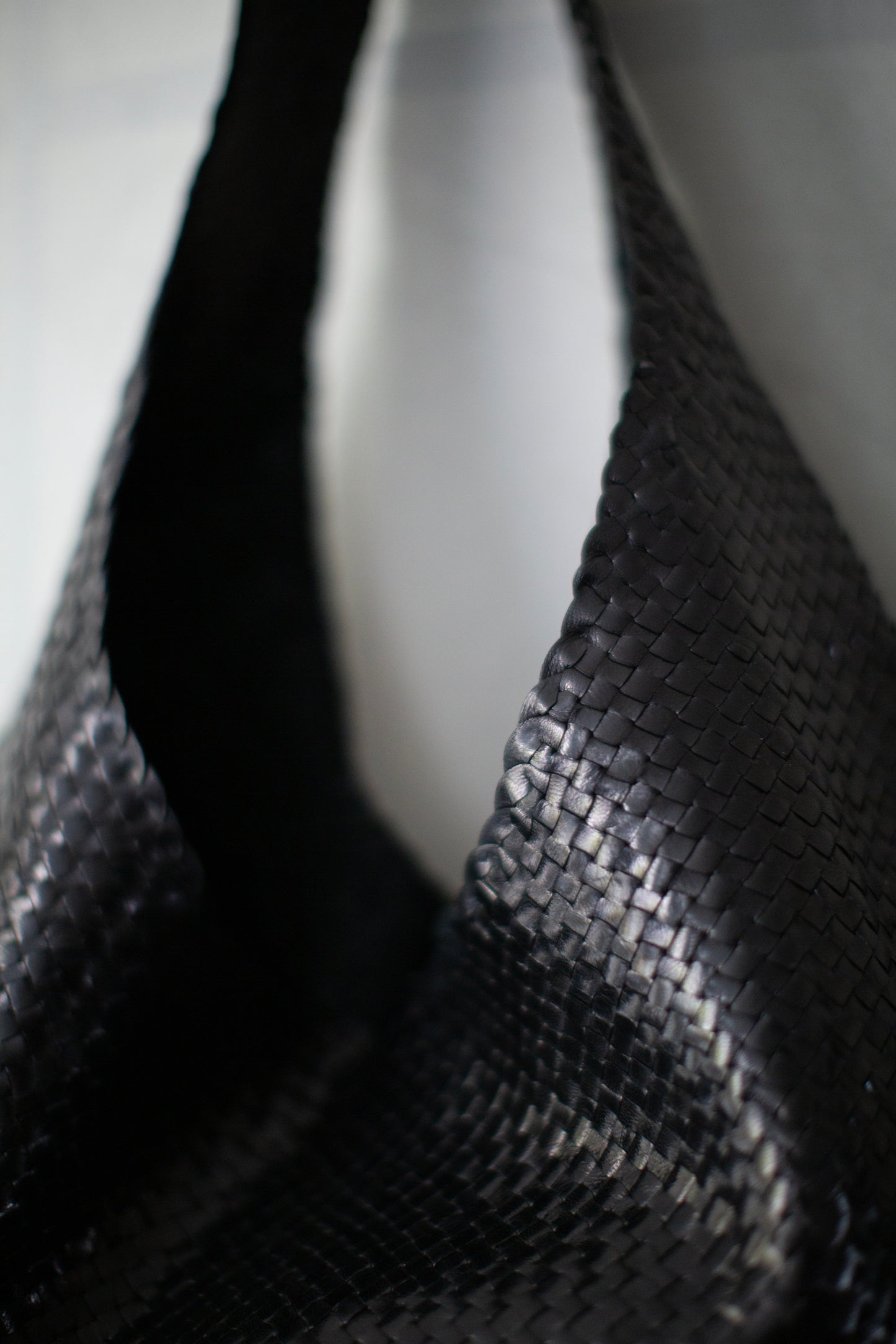 Seamless hand woven black carrier bag in goat leather