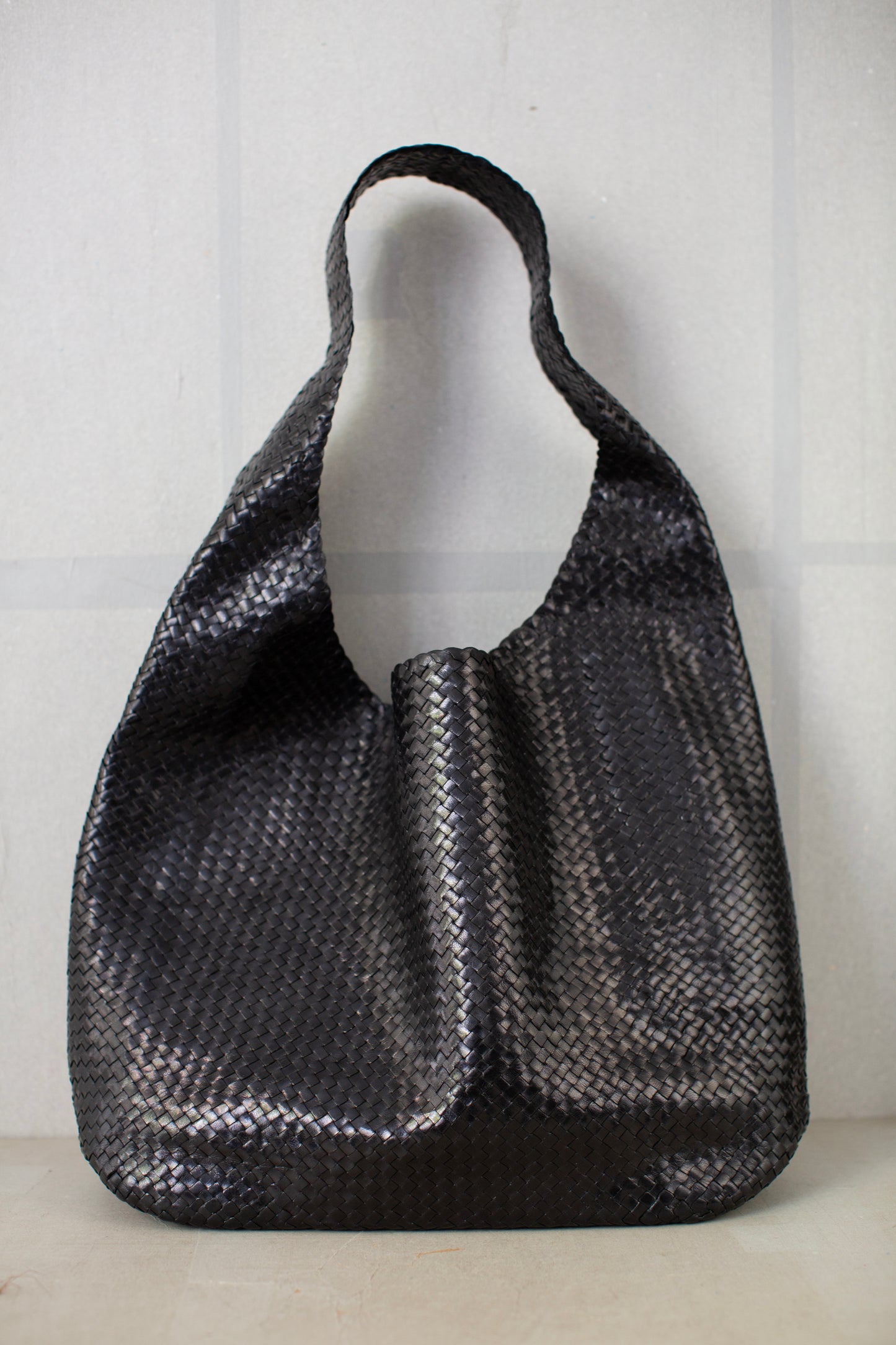 Seamless hand woven black carrier bag in goat leather