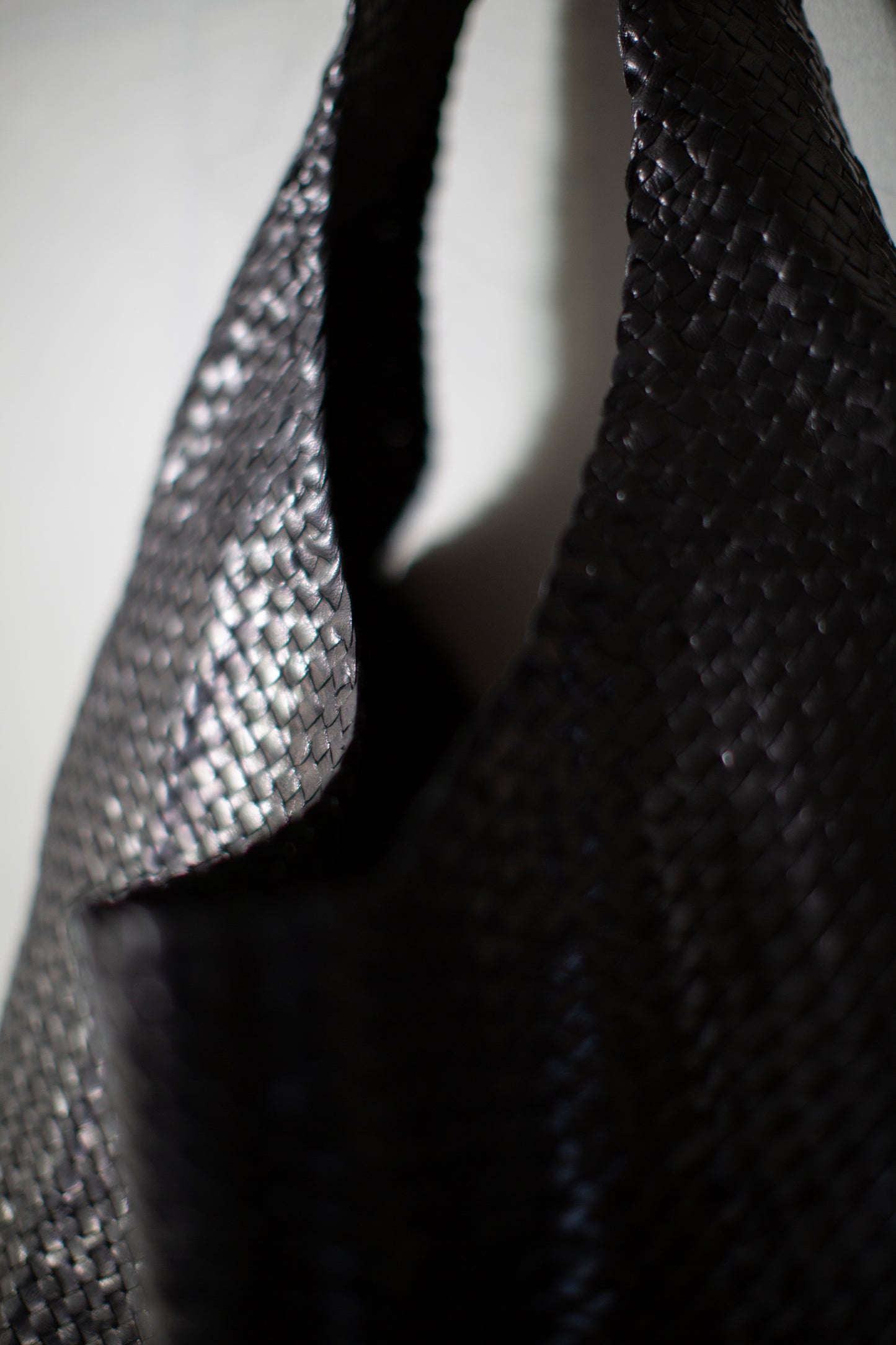 Seamless hand woven black carrier bag in goat leather