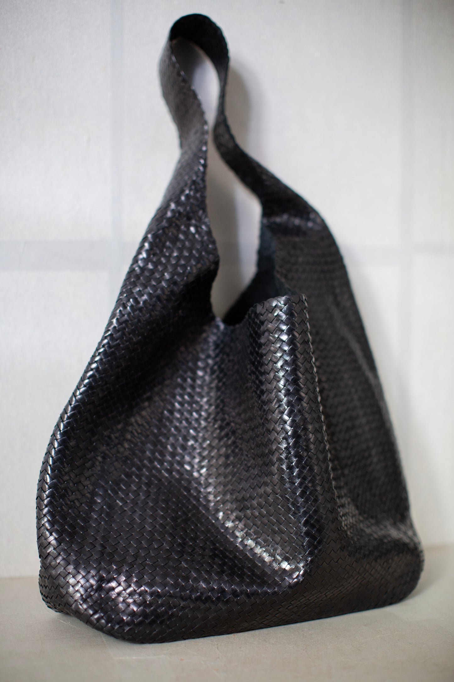 Seamless hand woven black carrier bag in goat leather