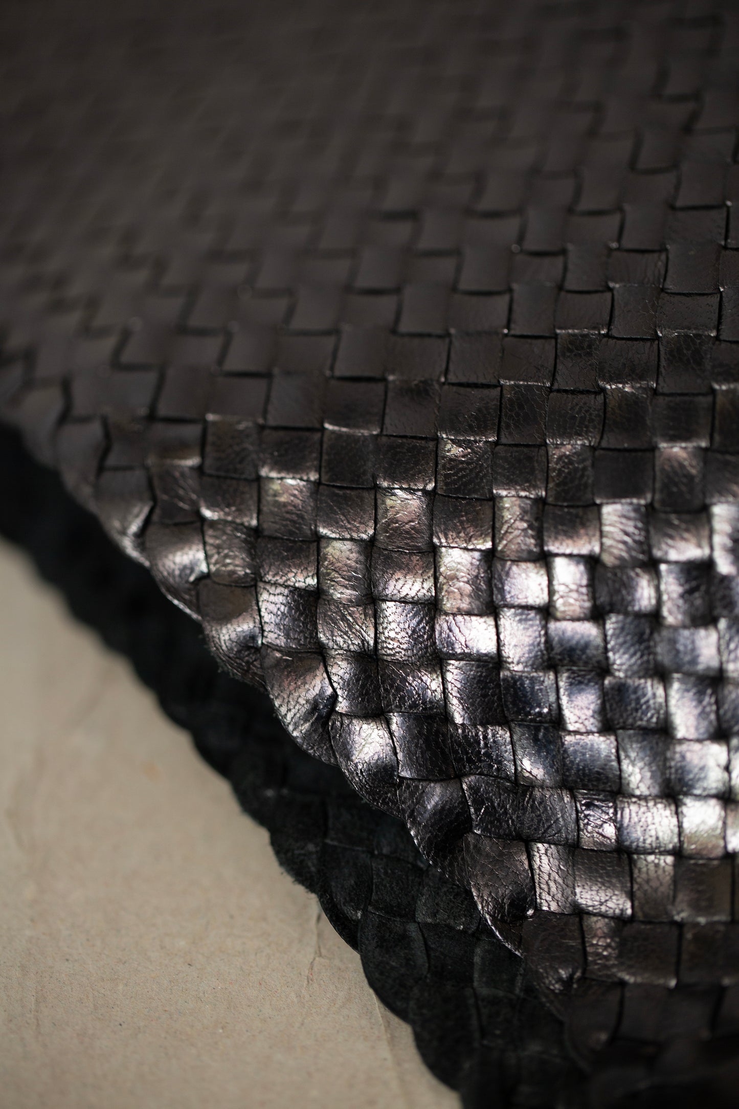 Seamless hand woven black carrier bag in goat leather
