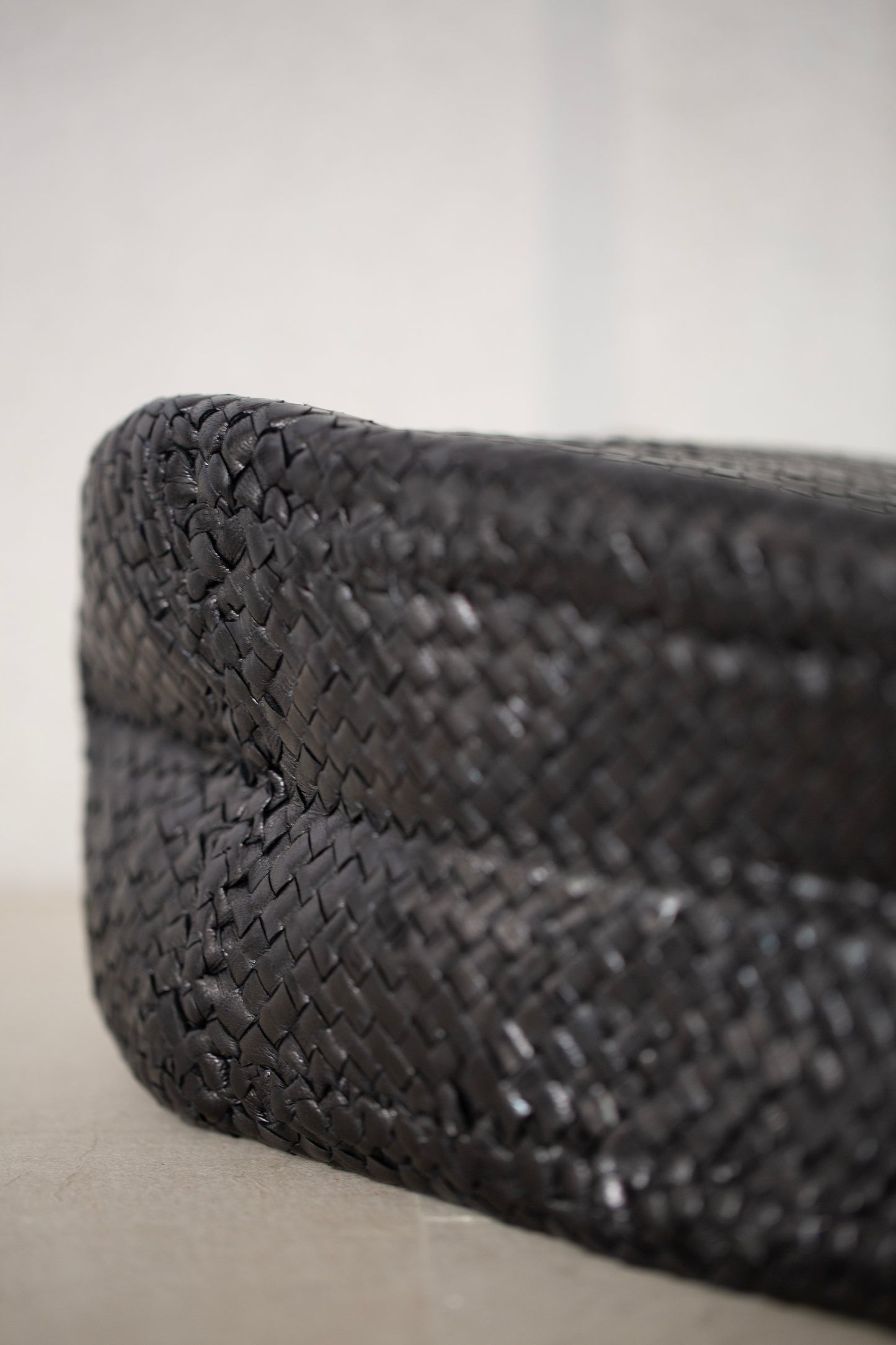 Seamless hand woven black carrier bag in goat leather