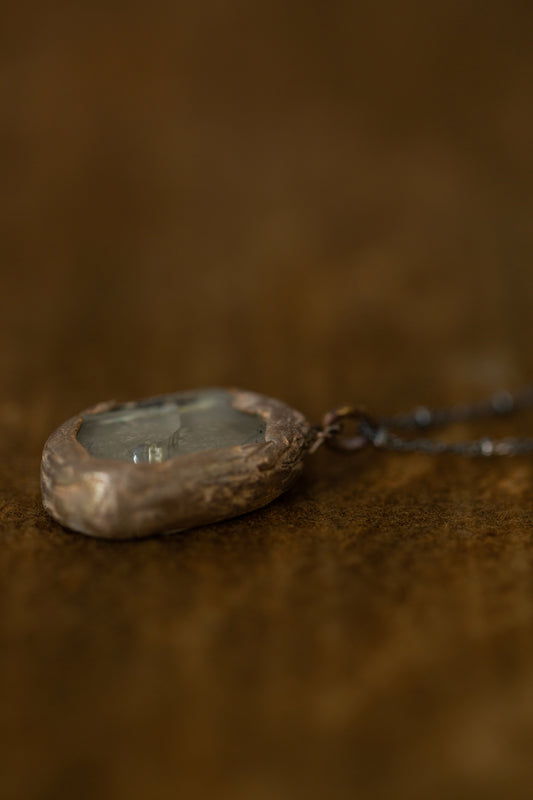 Necklace with silver framed glass