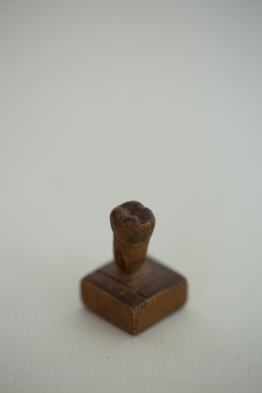 small sculpture woodcarved human tooth