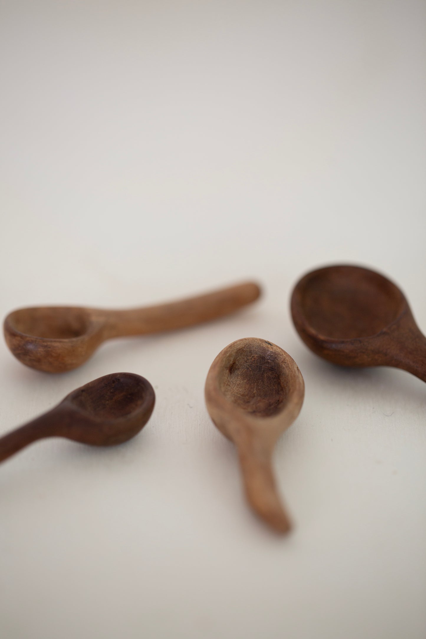 Set of little carved wooden spoons