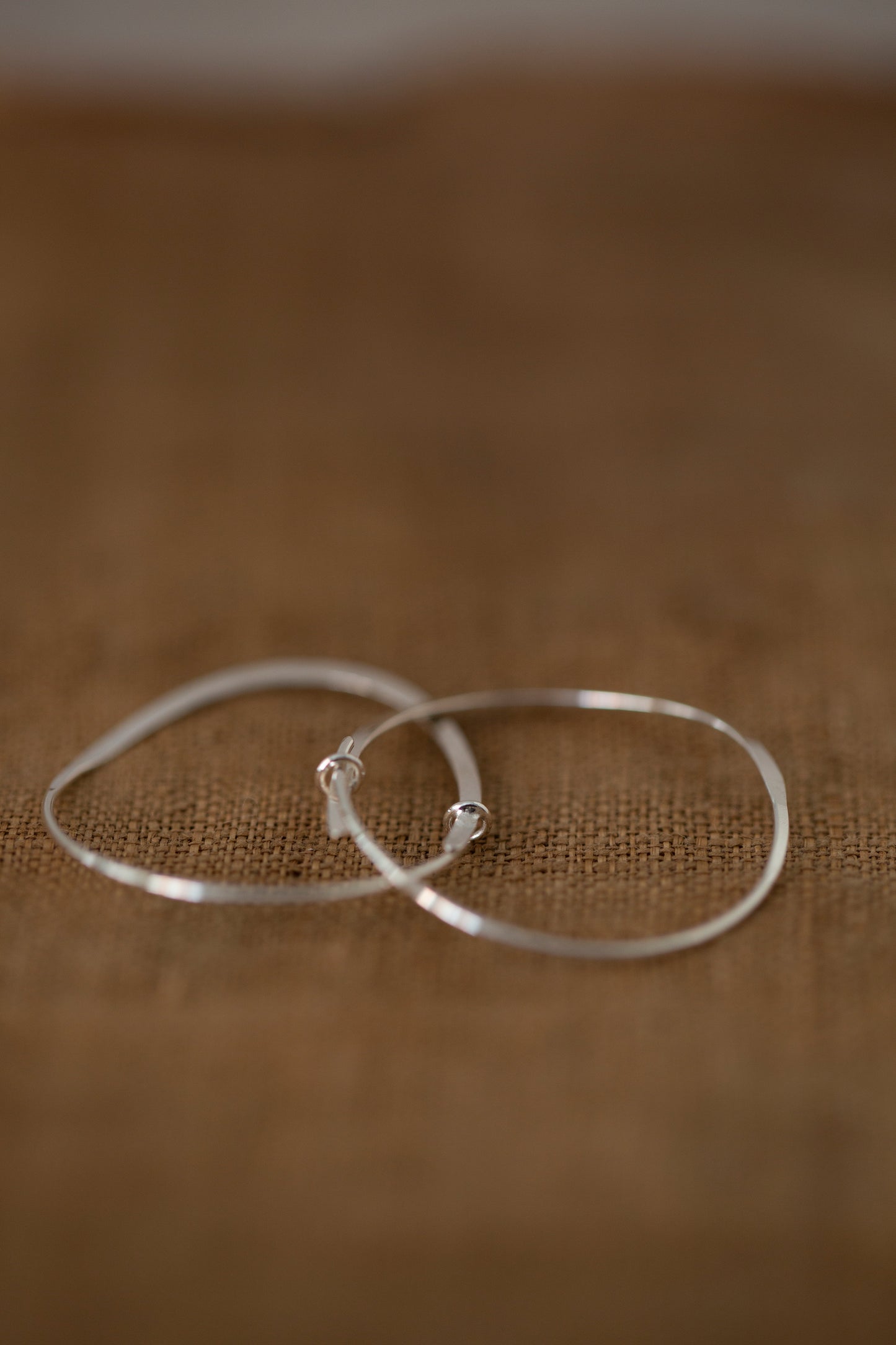 Pair Of Silver Hand Forged Earrings - medium